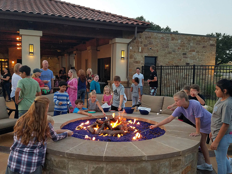 Toasting marshmallows in the firepit at the Palazzo Clubhouse