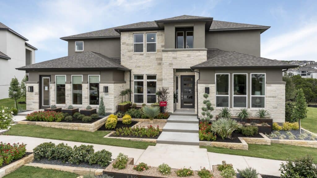 Beautiful contemporary house with lush garden and stone accents in Travisso.