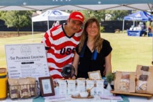 Community members at Travisso enjoying June celebrations and local vendors.