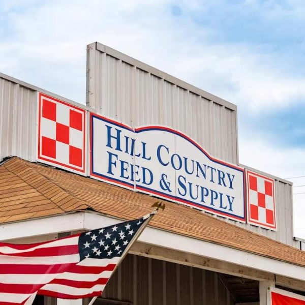Hill Country Feed & Supply store with American flag in Leander, TX.
