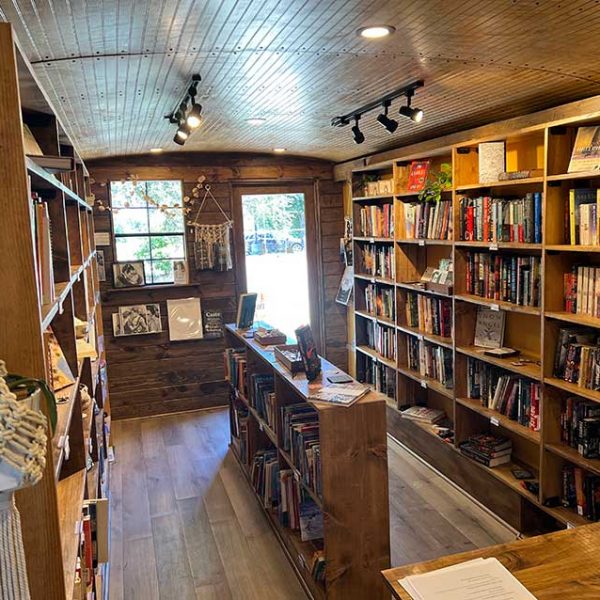 Cozy community library with wooden shelves and natural light in Leander.