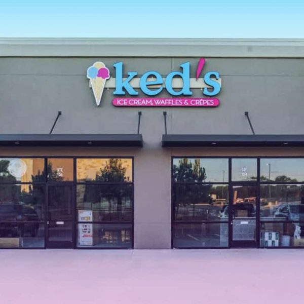 Ked's ice cream shop exterior in Leander with colorful sign and large windows.